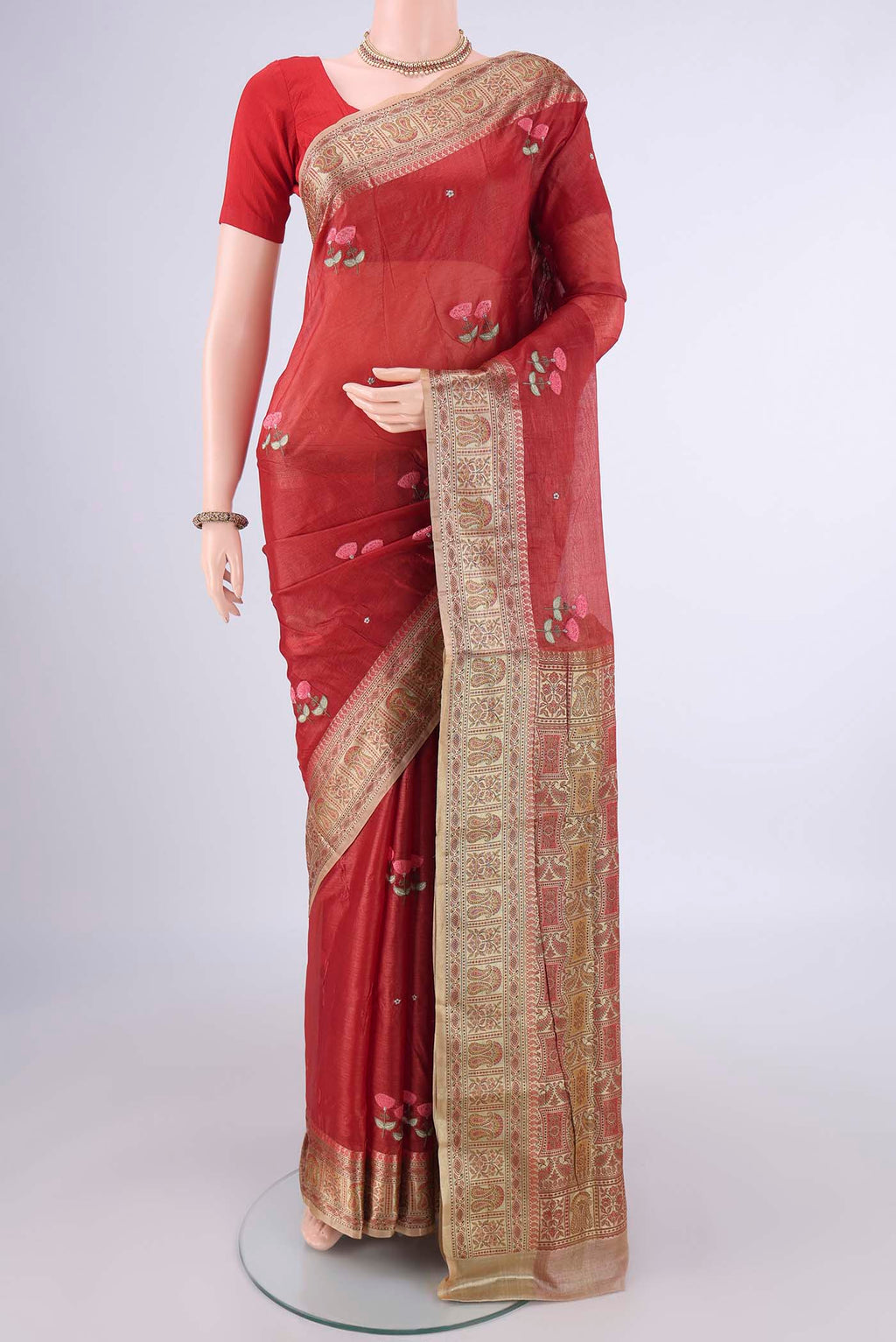 Red Banarasi Tussar Silk Saree with Embroidery on the body and Zari Border.  displayed on a mannequin