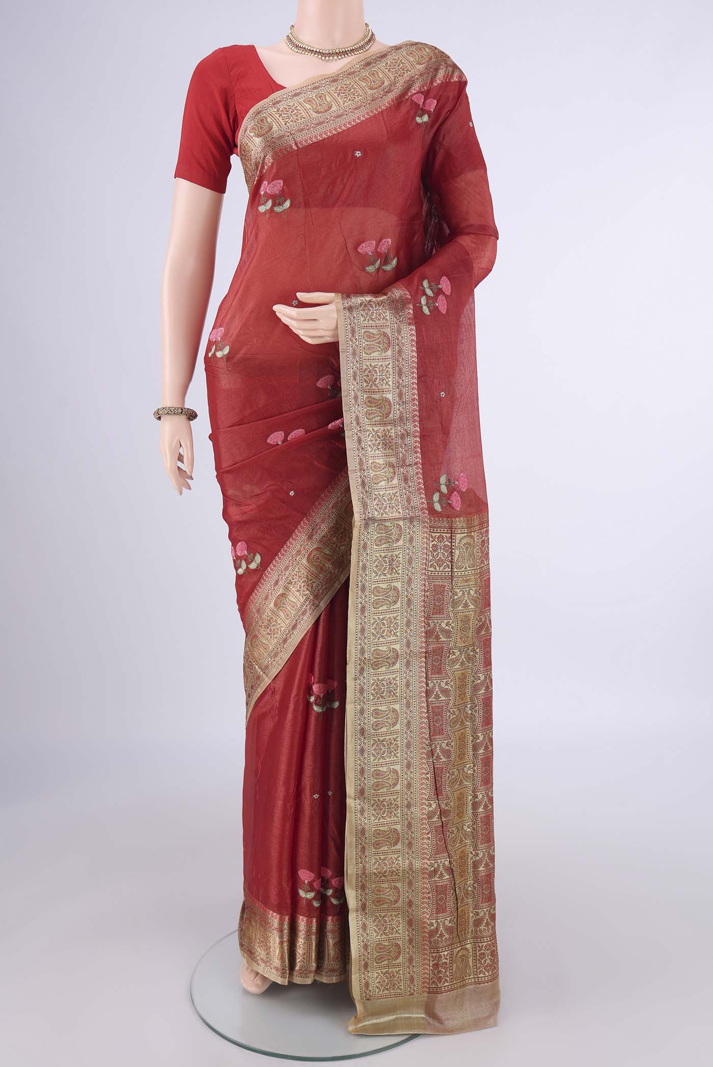 Red Banarasi Tussar Silk Saree with Embroidery on the body and Zari Border.  displayed on a mannequin