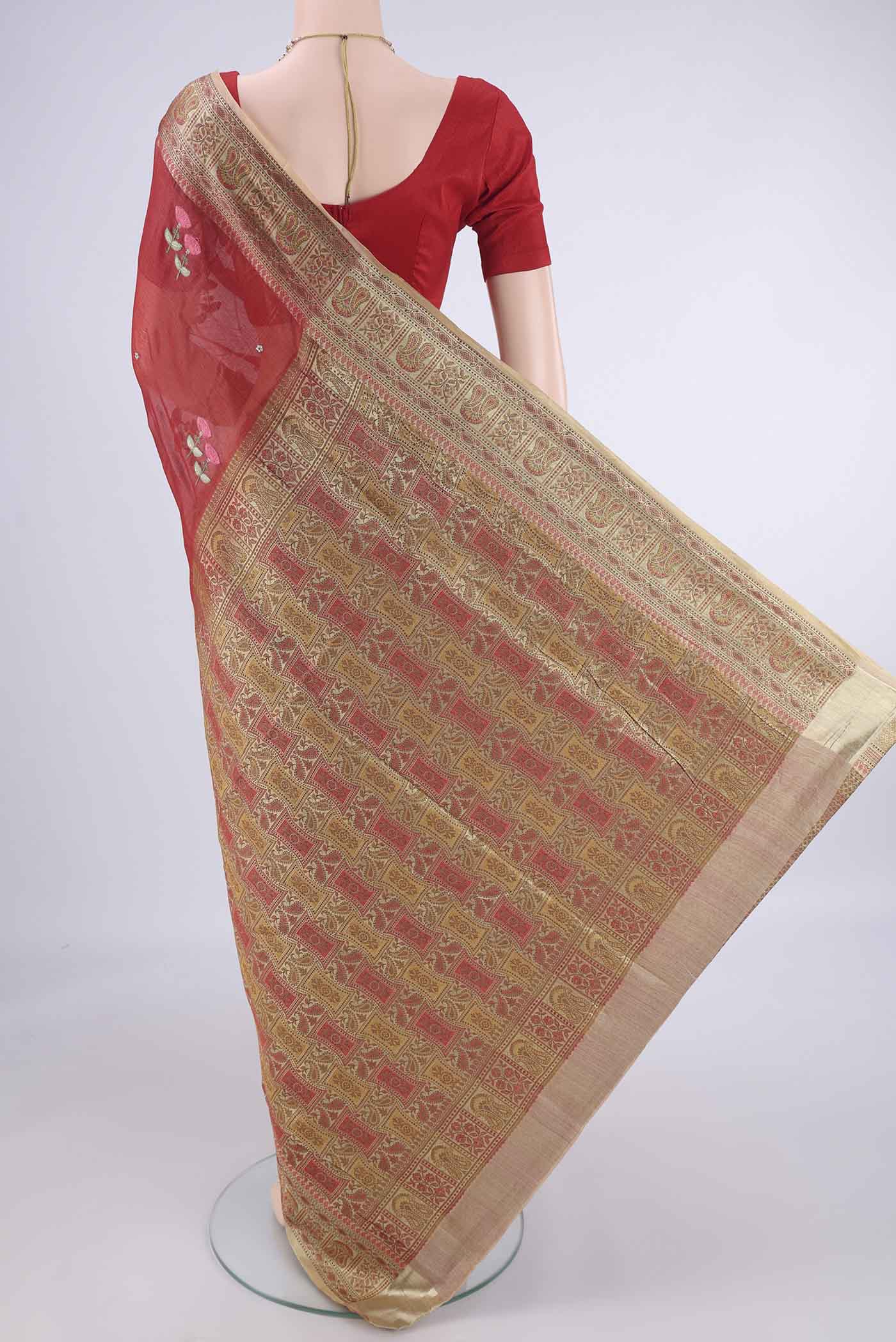 Flat view of Red Banarasi Tussar Silk Saree with Embroidery on the body and Zari Border. 