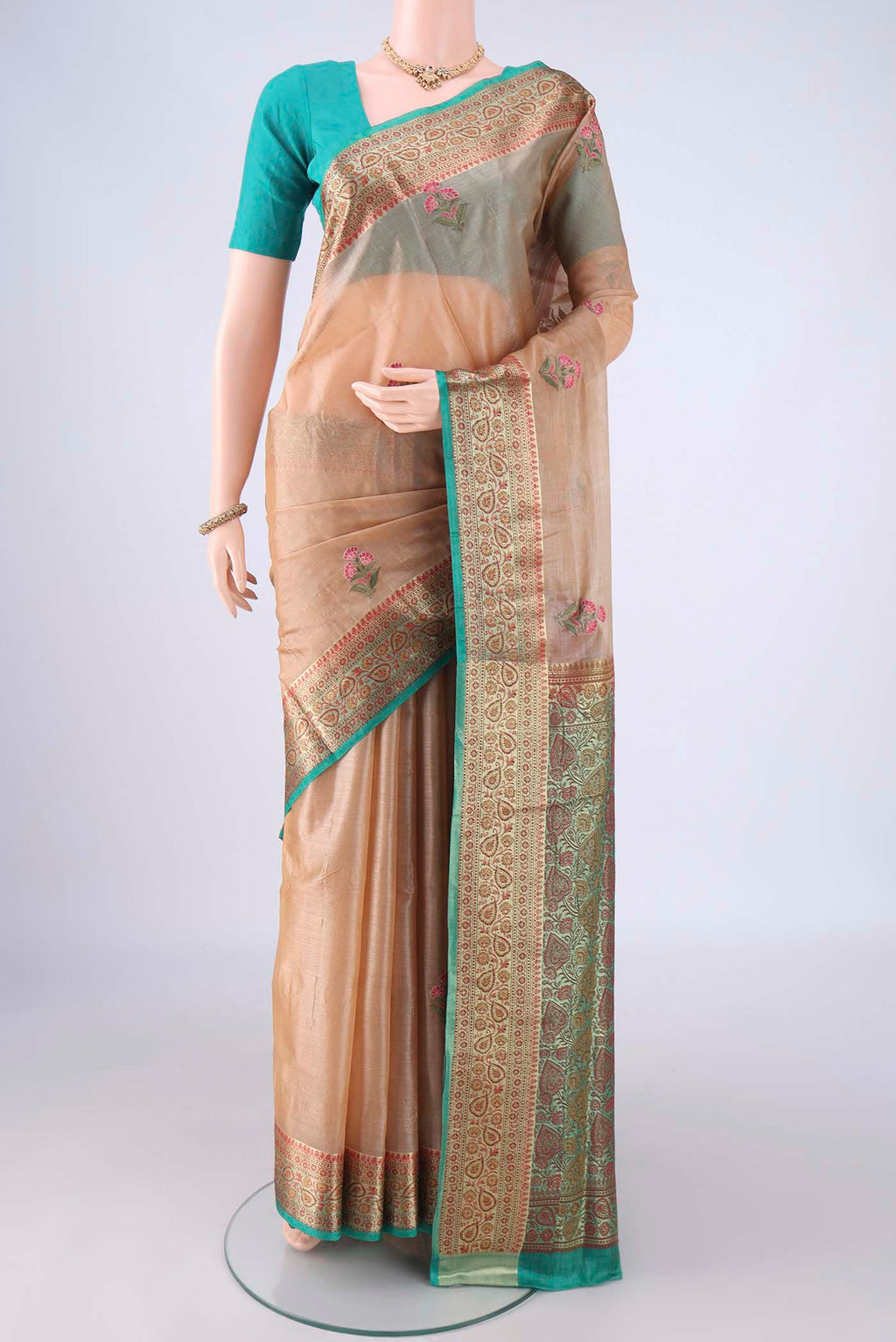 Beige Banarasi Tussar Silk Saree with Embroidery on the body and Zari Border.  displayed on a mannequin