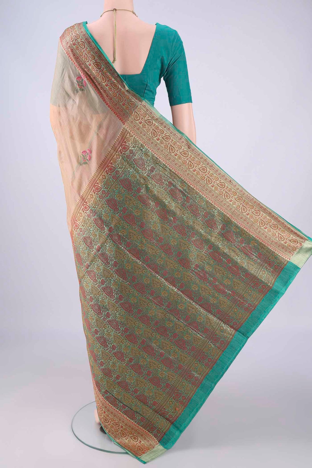 Flat view of Beige Banarasi Tussar Silk Saree with Embroidery on the body and Zari Border. 