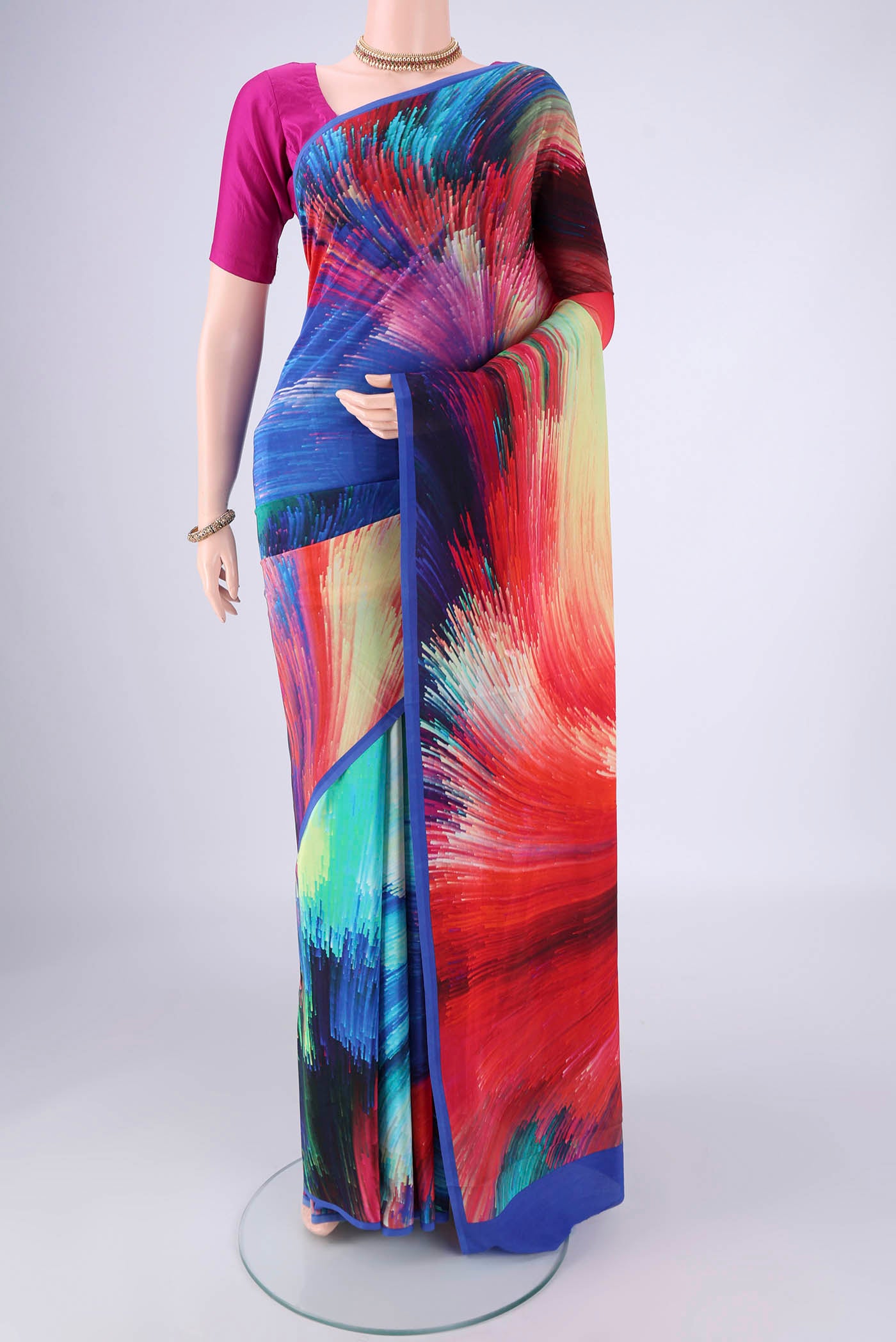 Multi Color Mysore Crepe Saree with Printed design on the body and Printed Border.  displayed on a mannequin