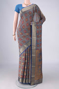 Light Blue Mysore Crepe Saree with Printed design on the body and Zari Border.  displayed on a mannequin