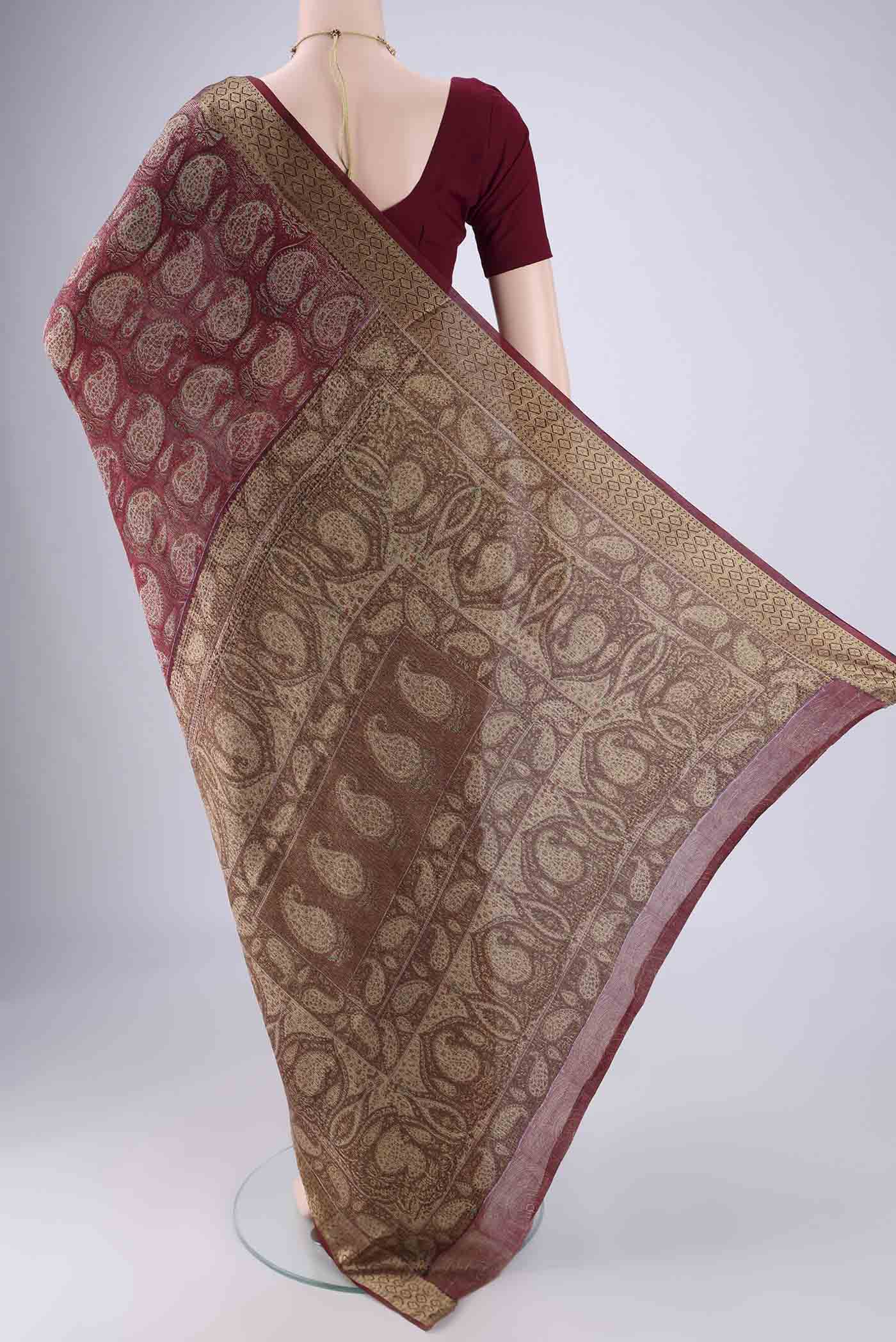 Flat view of Maroon Mysore Crepe Saree with Printed design on the body and Zari Border. 