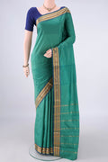 Sea Green Blended Bangalore Silk Saree with Plain Body and Zari Border.  displayed on a mannequin