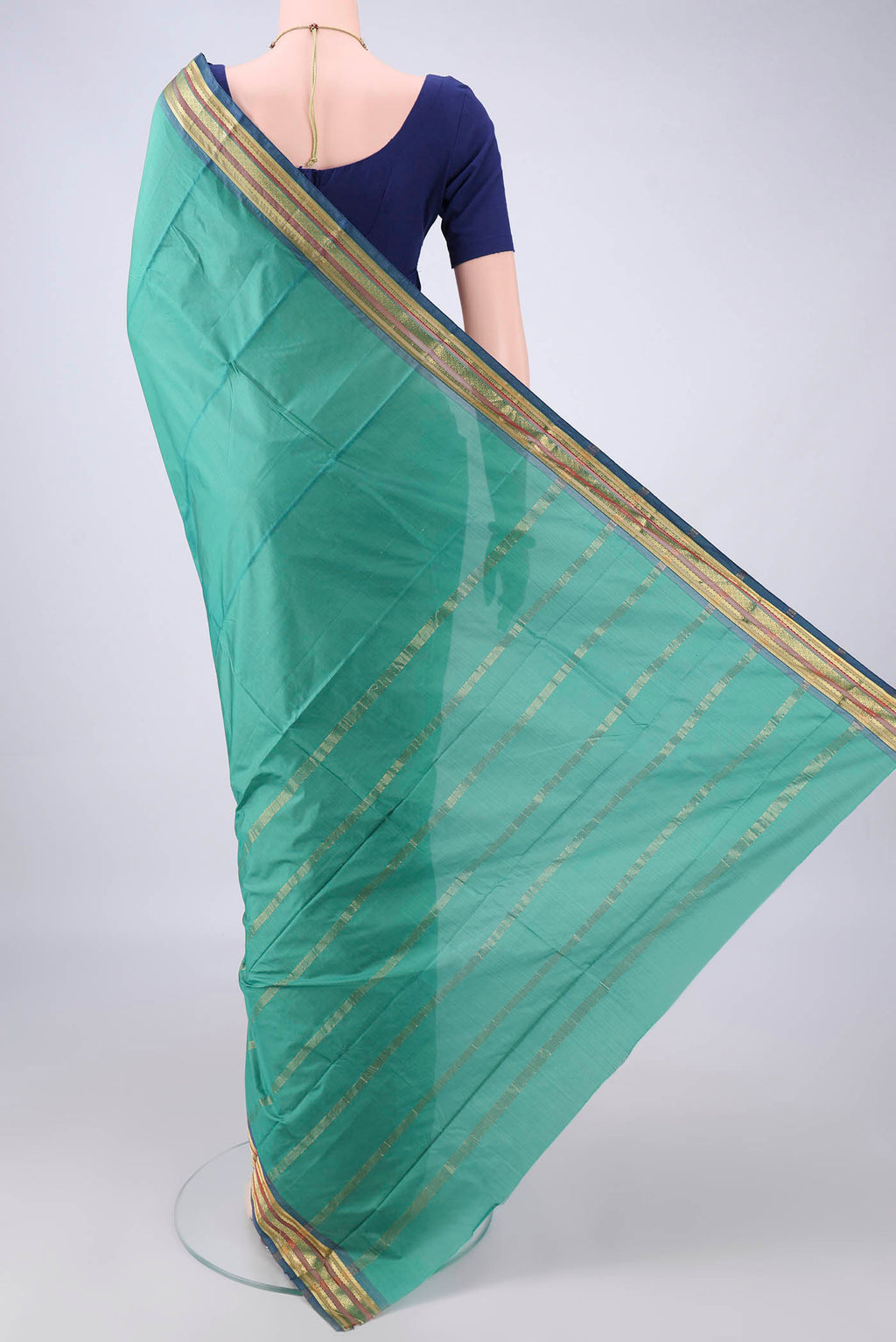 Flat view of Sea Green Blended Bangalore Silk Saree with Plain Body and Zari Border. 