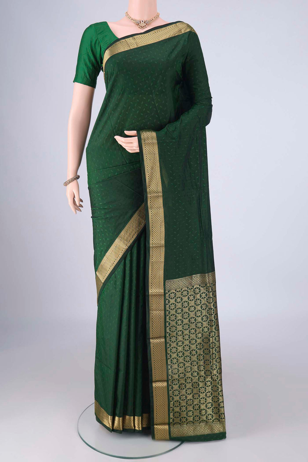 Bottle Green Blended Bangalore Silk Saree with Jacquard design on the body and Zari Border.  displayed on a mannequin