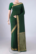 Bottle Green Blended Bangalore Silk Saree with Jacquard design on the body and Zari Border.  displayed on a mannequin
