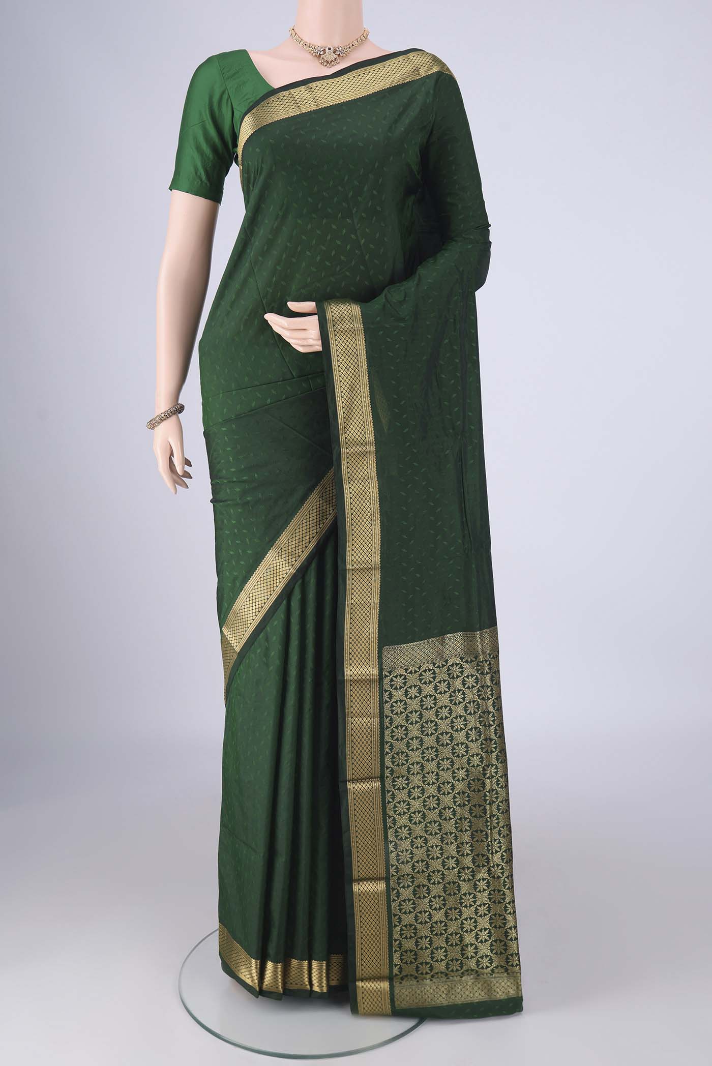 Bottle Green Blended Bangalore Silk Saree with Jacquard design on the body and Zari Border.  displayed on a mannequin