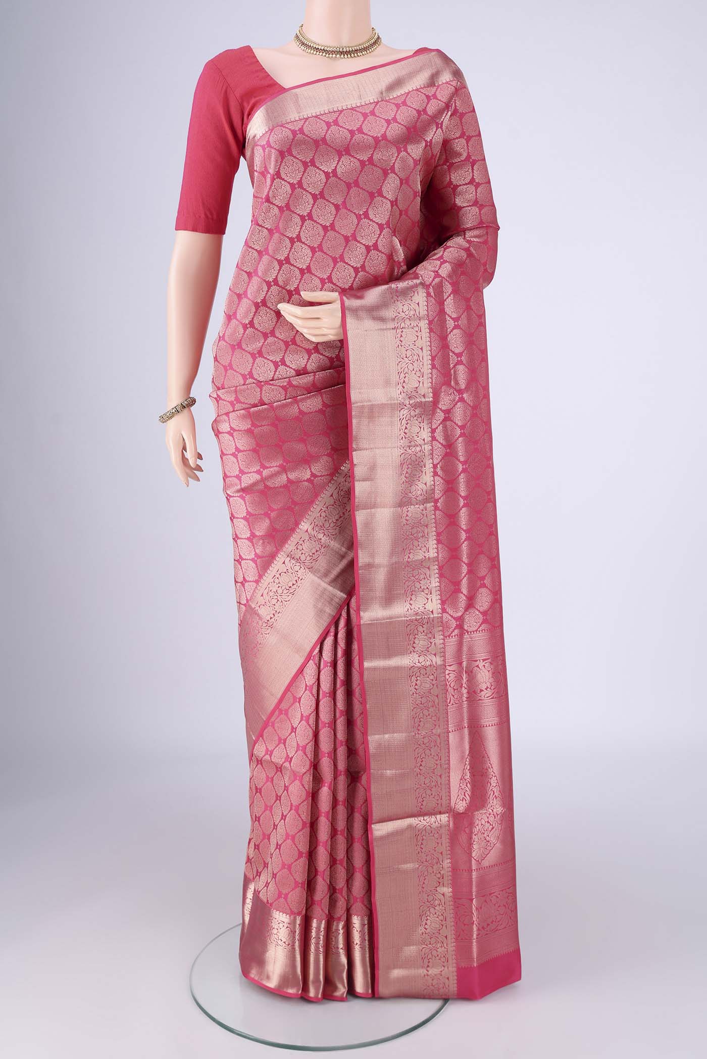 Pink Soft Silk Saree with Zari Brocade on the body and Zari Border.  displayed on a mannequin