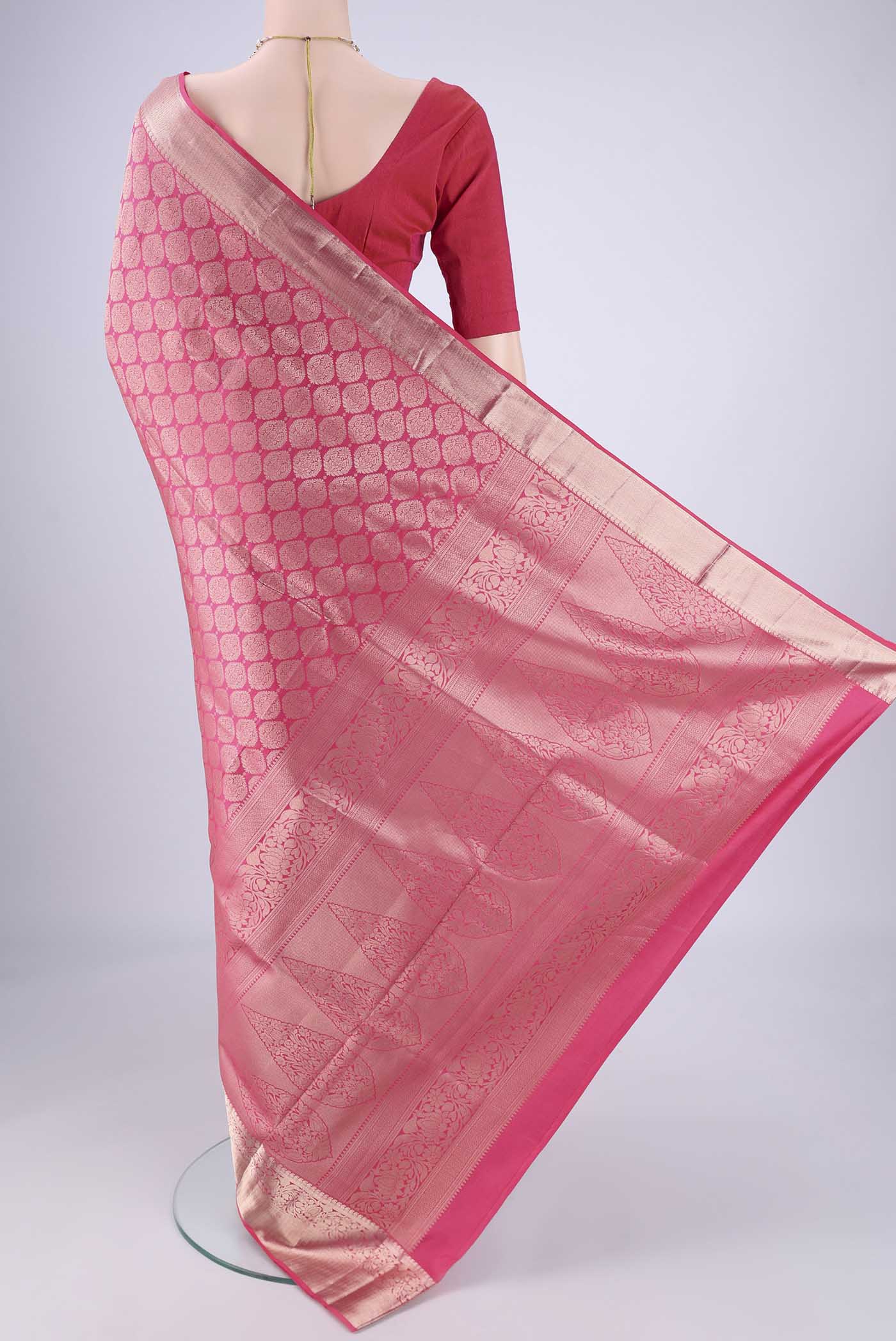 Flat view of Pink Soft Silk Saree with Zari Brocade on the body and Zari Border. 