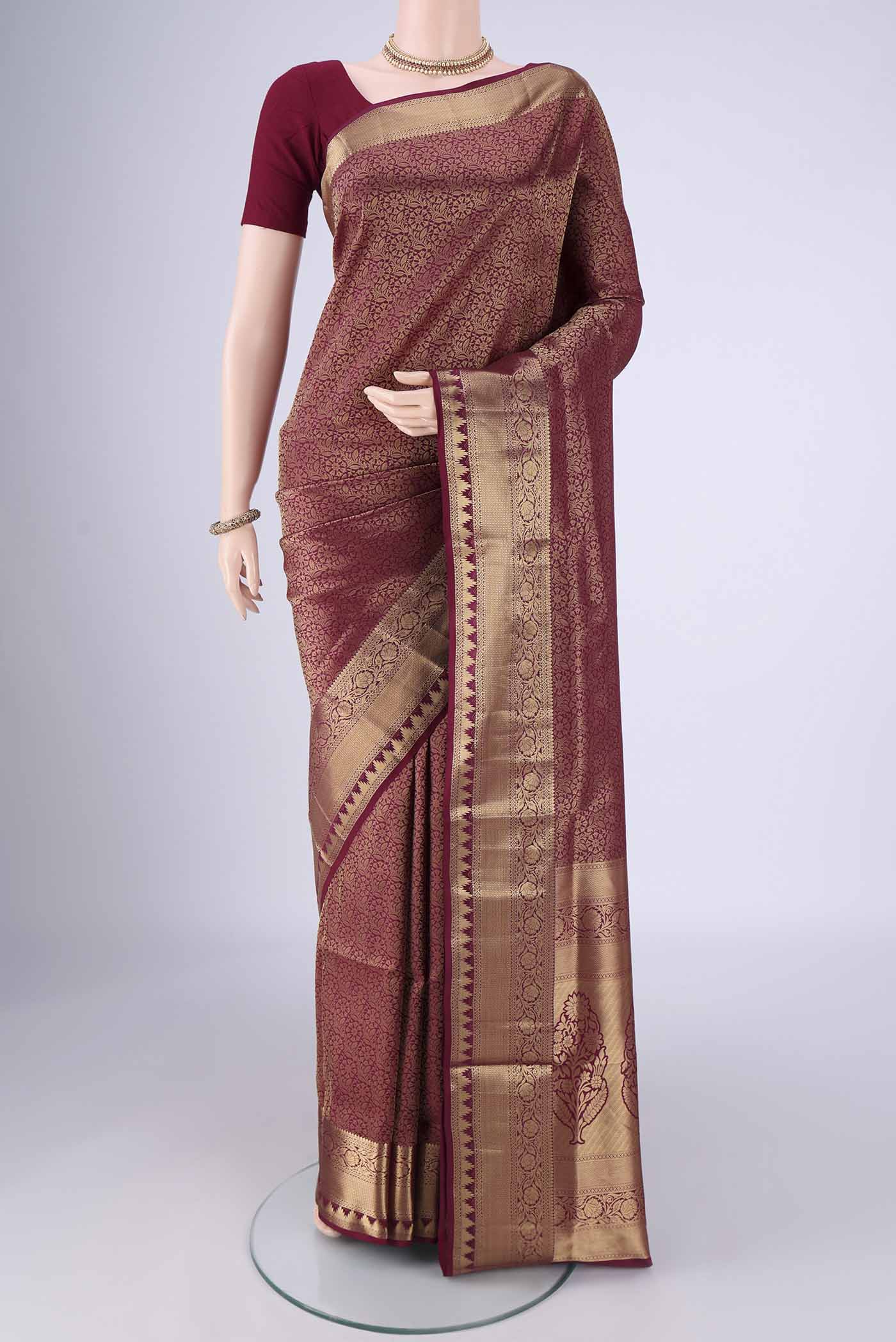 Maroon Soft Silk Saree with Zari Brocade on the body and Zari Border.  displayed on a mannequin