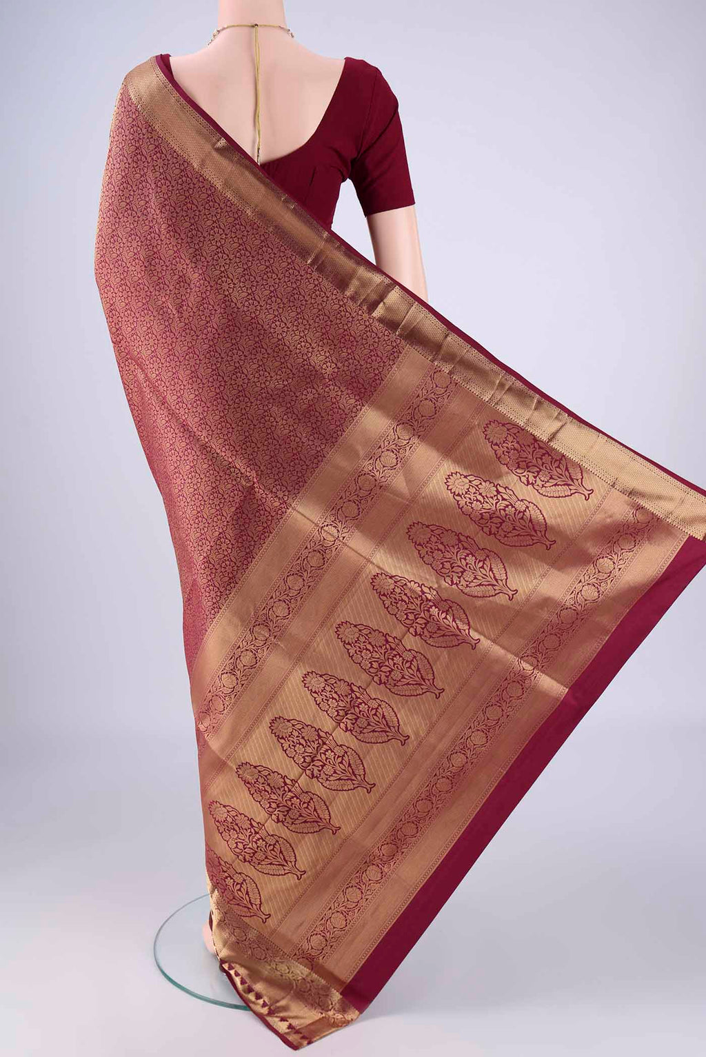 Flat view of Maroon Soft Silk Saree with Zari Brocade on the body and Zari Border. 