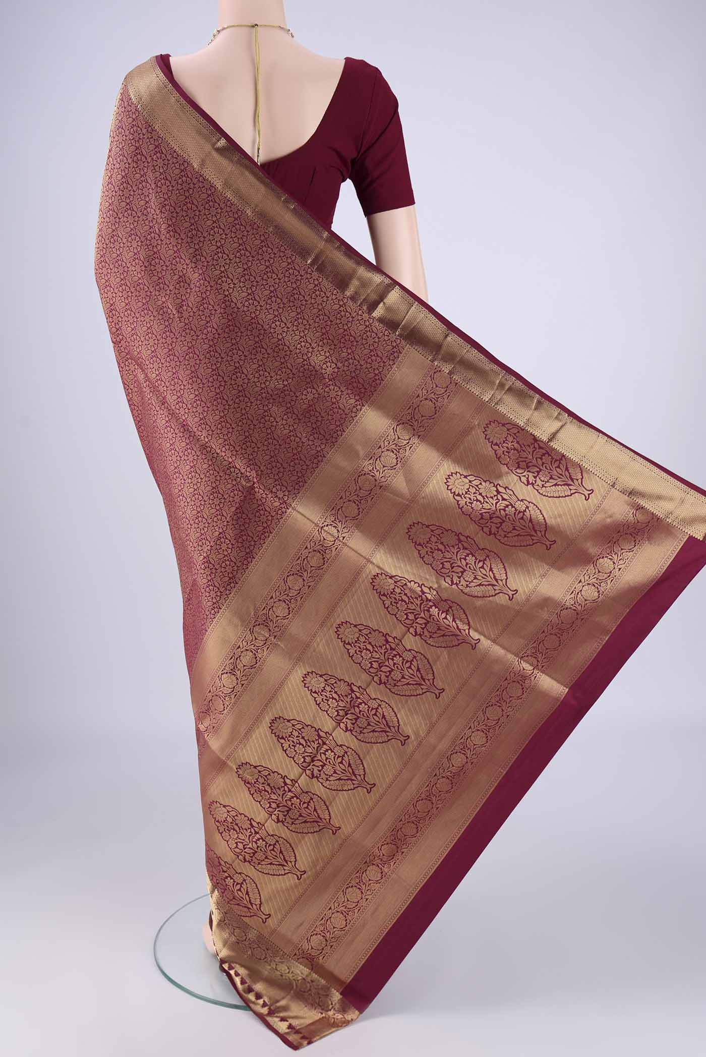 Flat view of Maroon Soft Silk Saree with Zari Brocade on the body and Zari Border. 