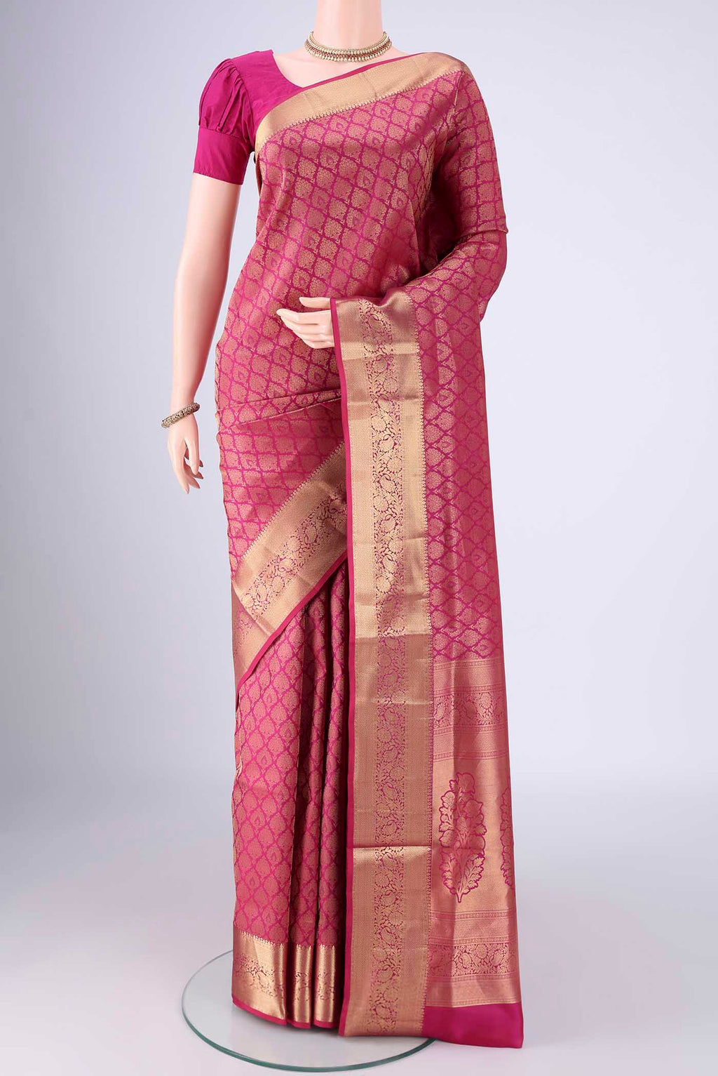 Pink Soft Silk Saree with Zari Brocade on the body and Zari Border.  displayed on a mannequin