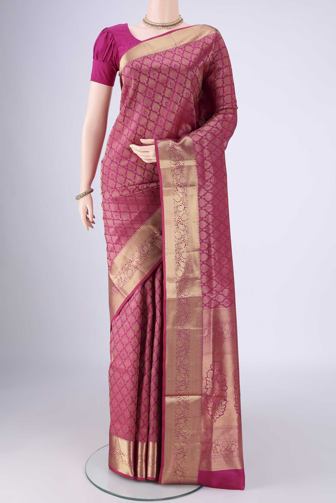 Pink Soft Silk Saree with Zari Brocade on the body and Zari Border.  displayed on a mannequin