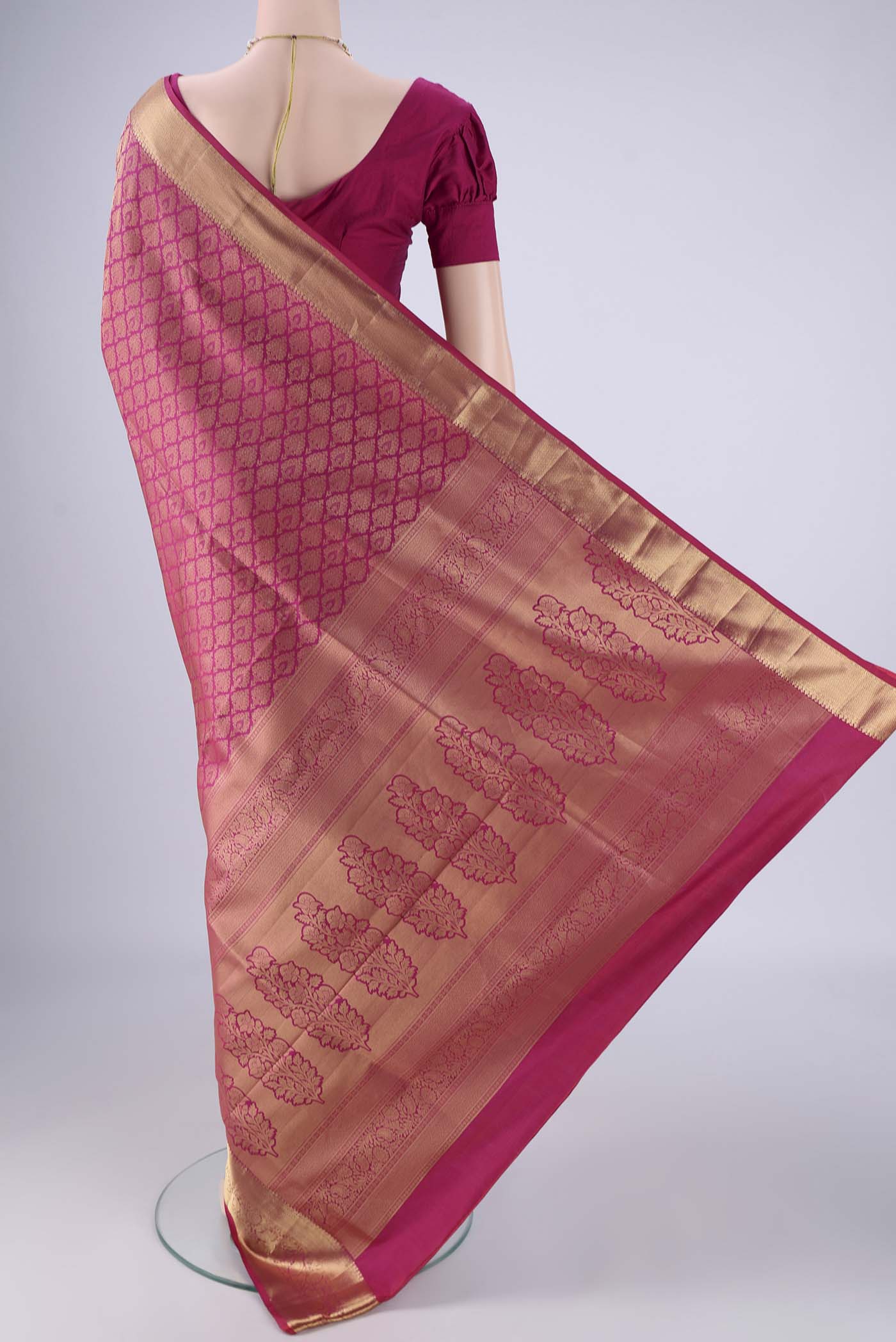 Flat view of Pink Soft Silk Saree with Zari Brocade on the body and Zari Border. 
