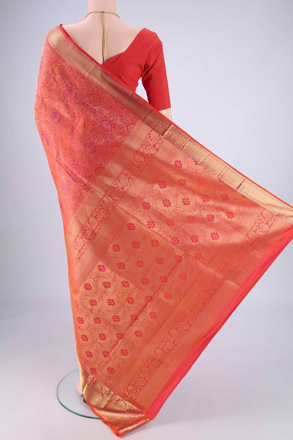 Flat view of Coral Soft Silk Saree with Zari Brocade on the body and Zari Border. 