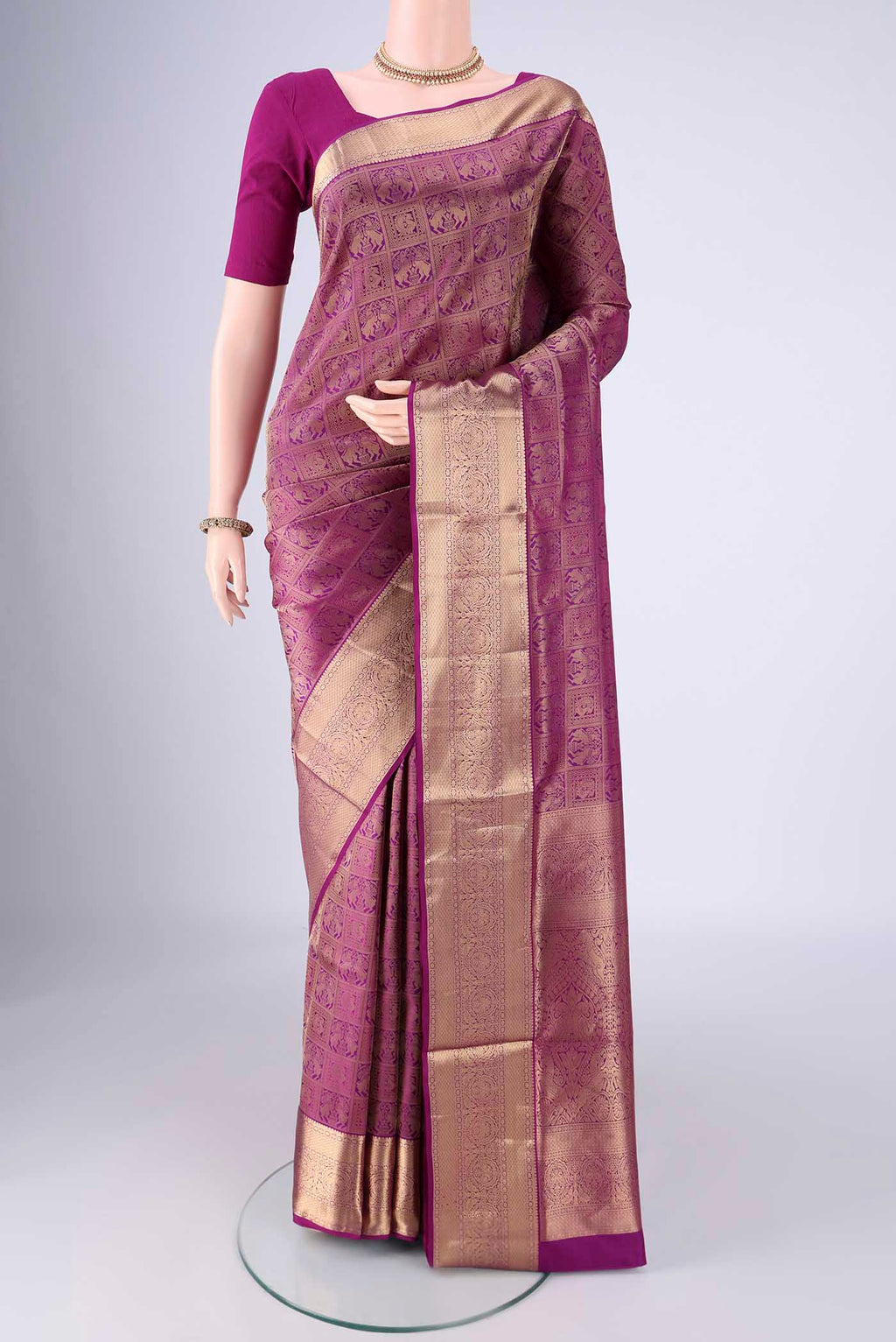 Purple Soft Silk Saree with Zari Brocade on the body and Zari Border.  displayed on a mannequin