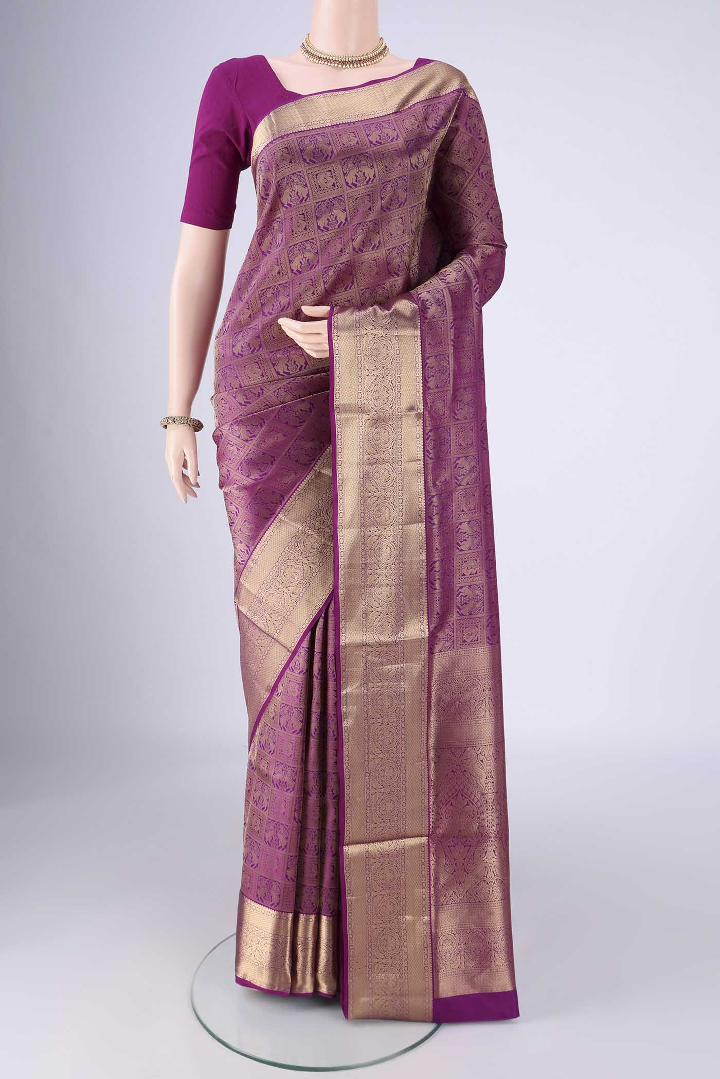Purple Soft Silk Saree with Zari Brocade on the body and Zari Border.  displayed on a mannequin