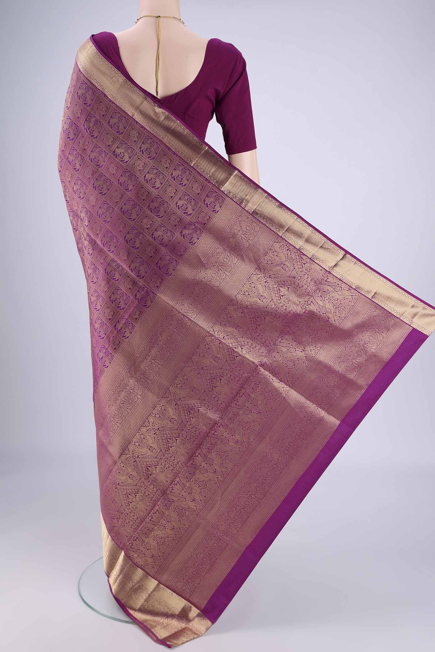 Flat view of Purple Soft Silk Saree with Zari Brocade on the body and Zari Border. 