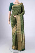Bottle Green Soft Silk Saree with Zari Brocade on the body and Zari Border.  displayed on a mannequin