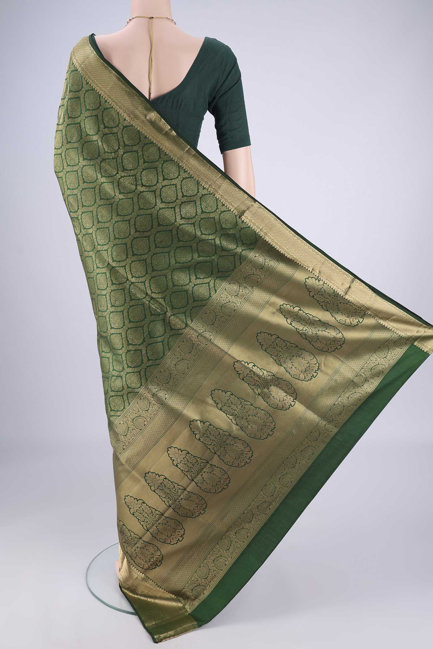 Flat view of Bottle Green Soft Silk Saree with Zari Brocade on the body and Zari Border. 