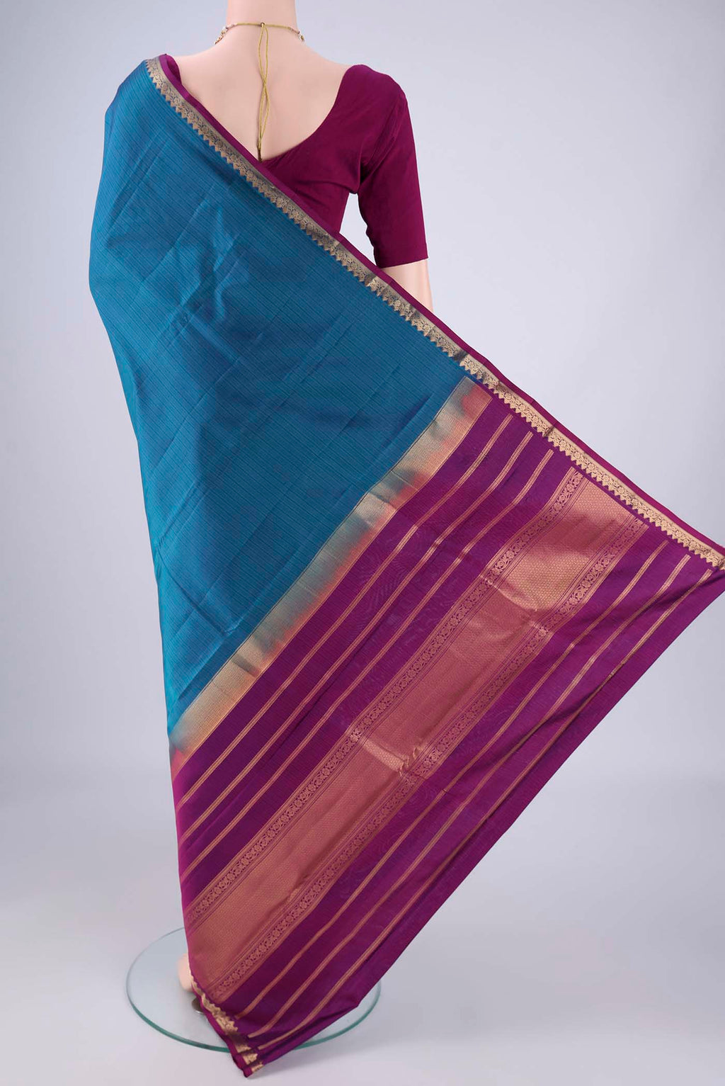 Flat view of Blue Kanjivaram Silk Saree with Stripes on the body and Zari Border. 