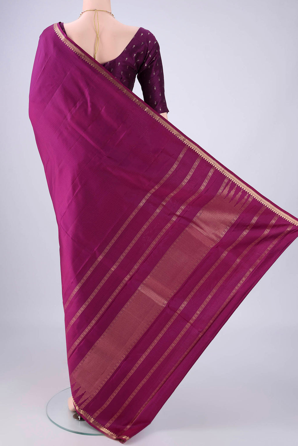 Flat view of Purple Kanjivaram Silk Saree with Stripes on the body and Zari Border. 