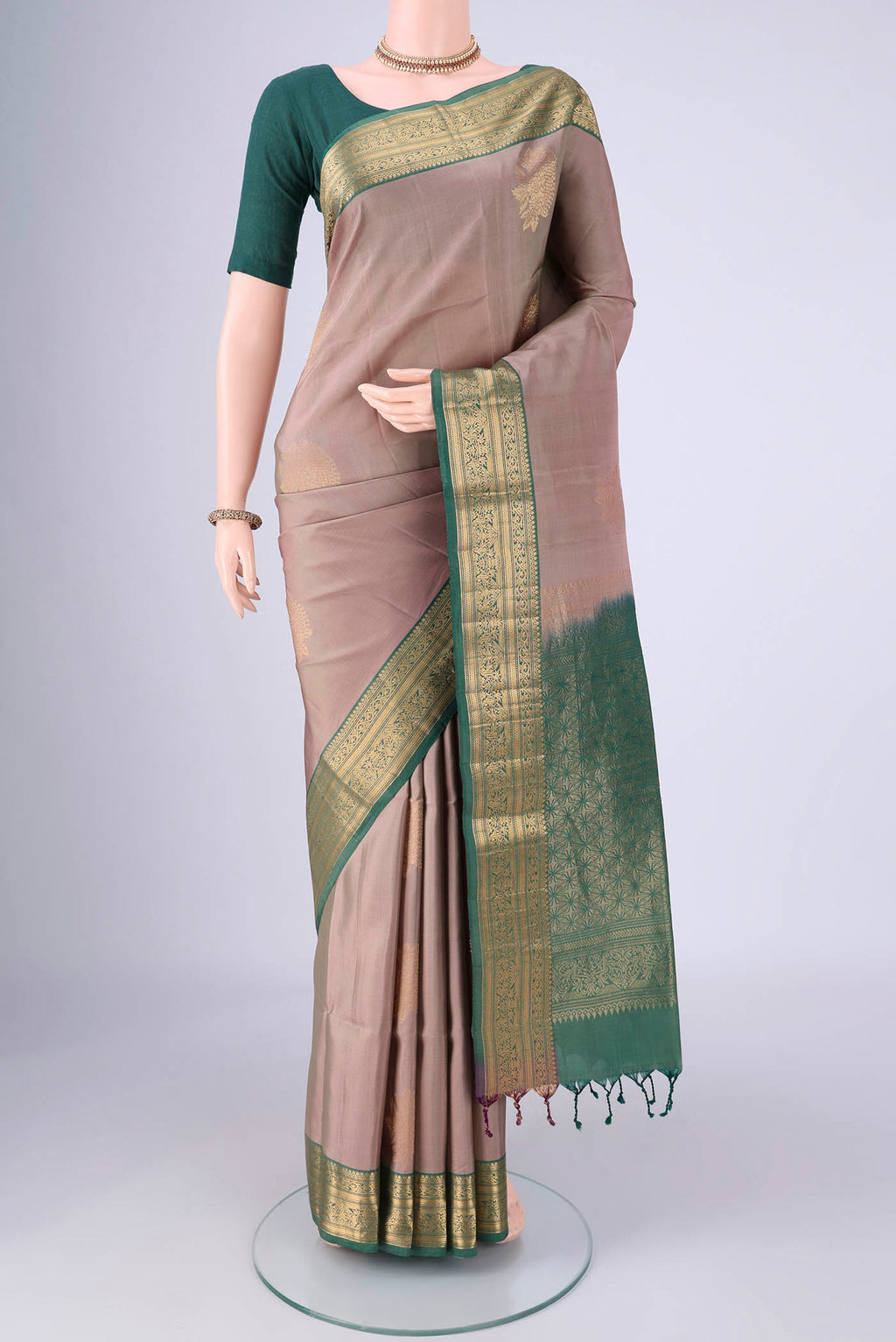 Grey Soft Silk Saree with Zari Butta on the body and Zari Border.  displayed on a mannequin