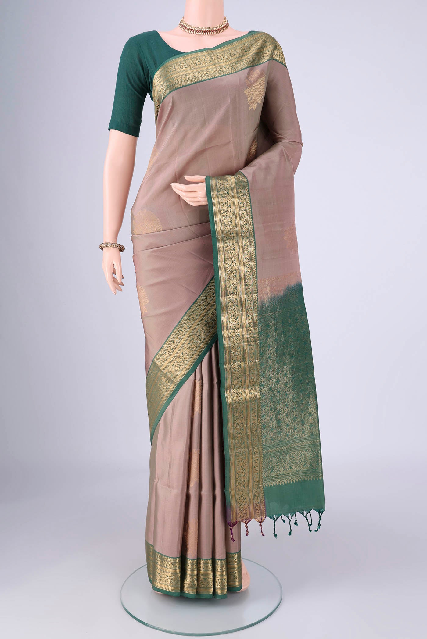 Grey Soft Silk Saree with Zari Butta on the body and Zari Border.  displayed on a mannequin