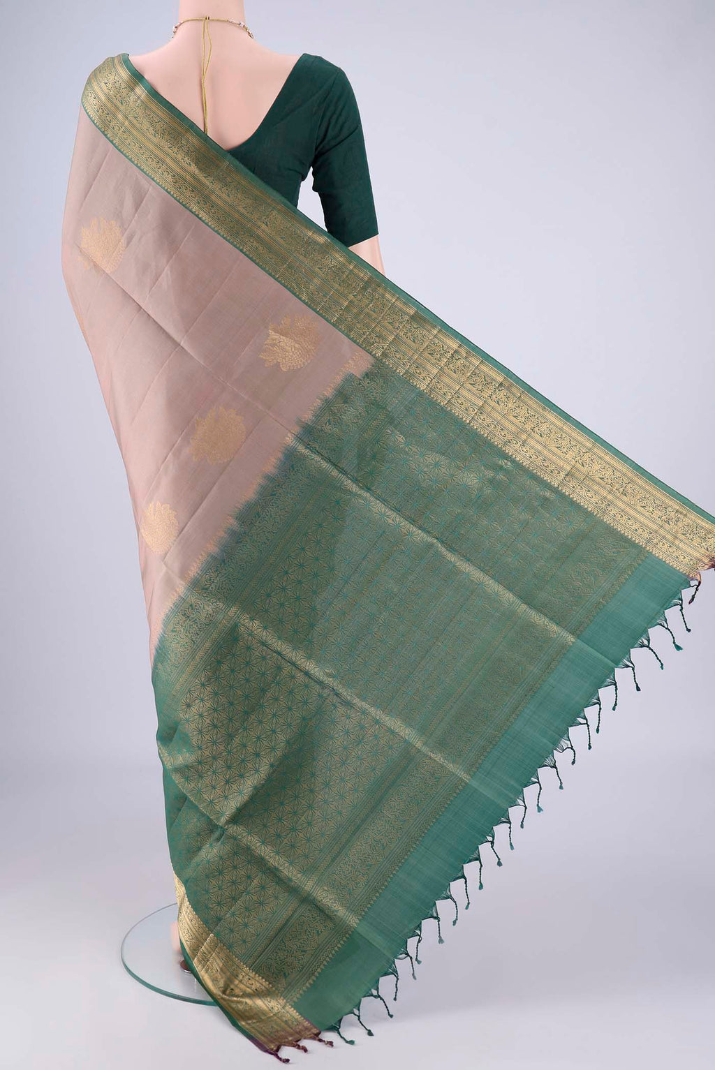 Flat view of Grey Soft Silk Saree with Zari Butta on the body and Zari Border. 