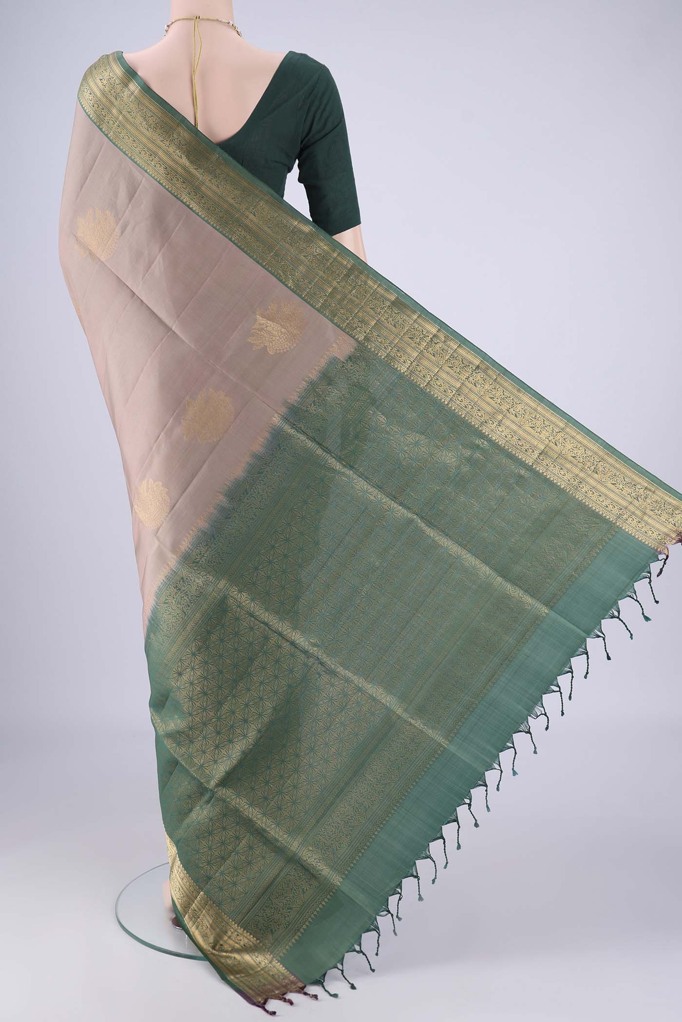 Flat view of Grey Soft Silk Saree with Zari Butta on the body and Zari Border. 