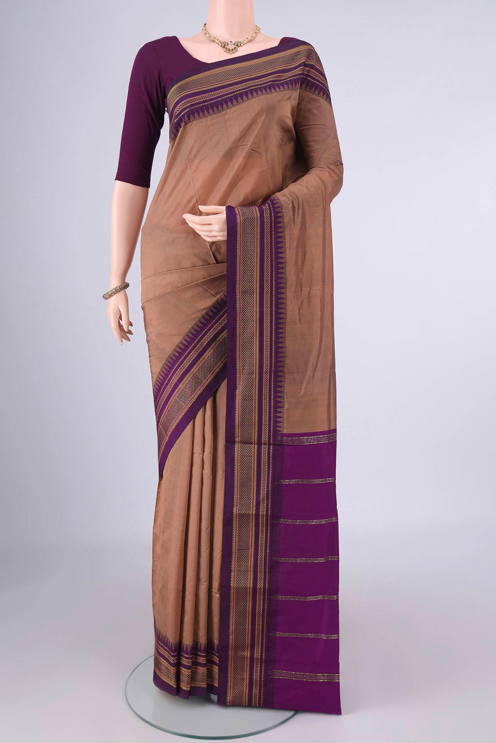 Brown Blended Bangalore Silk Saree with Plain Body and Zari Border.  displayed on a mannequin