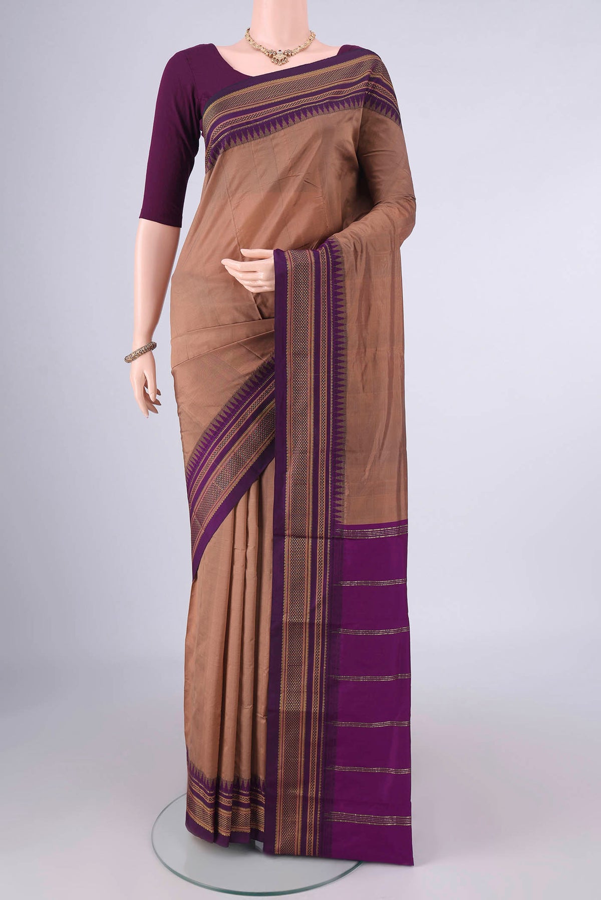 Brown Blended Bangalore Silk Saree with Plain Body and Zari Border.  displayed on a mannequin