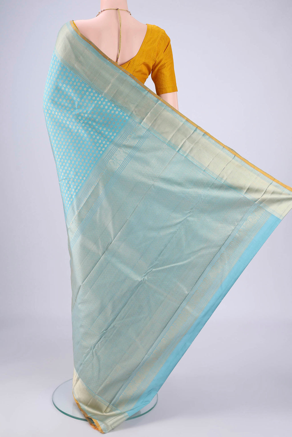 Flat view of Sky Blue Kanchipuram Silk Saree with Thread Brocade on the body and Thread Border. 