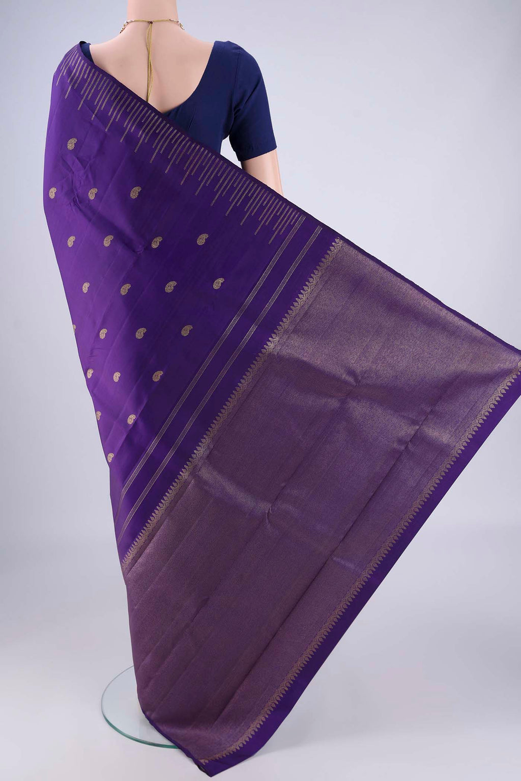 Flat view of Pure Silk Pure Zari Violet Kanchipuram Saree with Zari Butta on the body and Plain Border. 