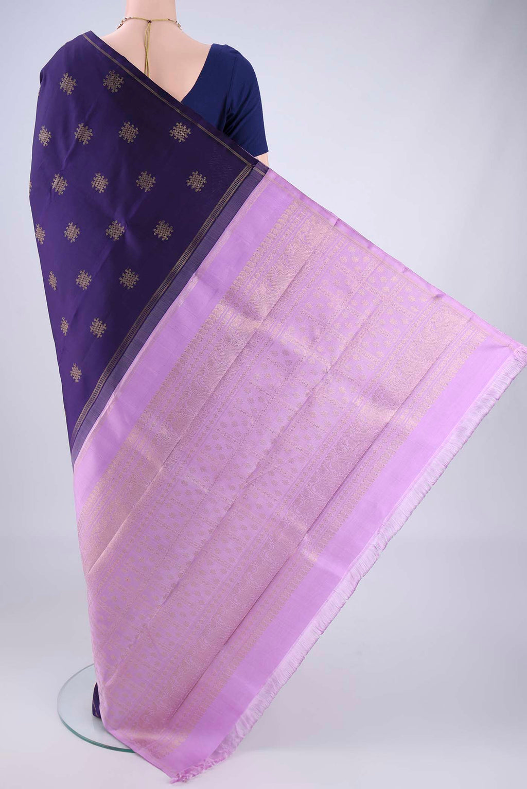Flat view of Pure Silk Pure Zari Navy Blue Kanchipuram Saree with Zari Butta on the body and Plain Border. 