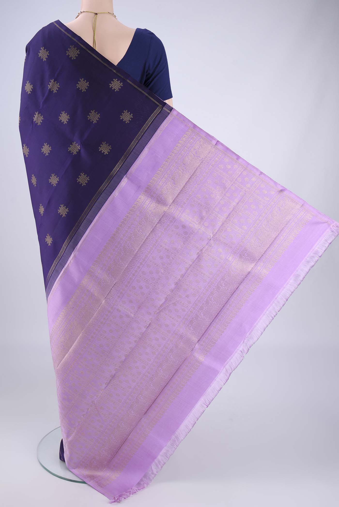 Flat view of Pure Silk Pure Zari Navy Blue Kanchipuram Saree with Zari Butta on the body and Plain Border. 