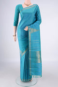 Pure Silk Pure Zari Light Blue Kanchipuram Saree with Checked design on the body and Zari Border.  displayed on a mannequin