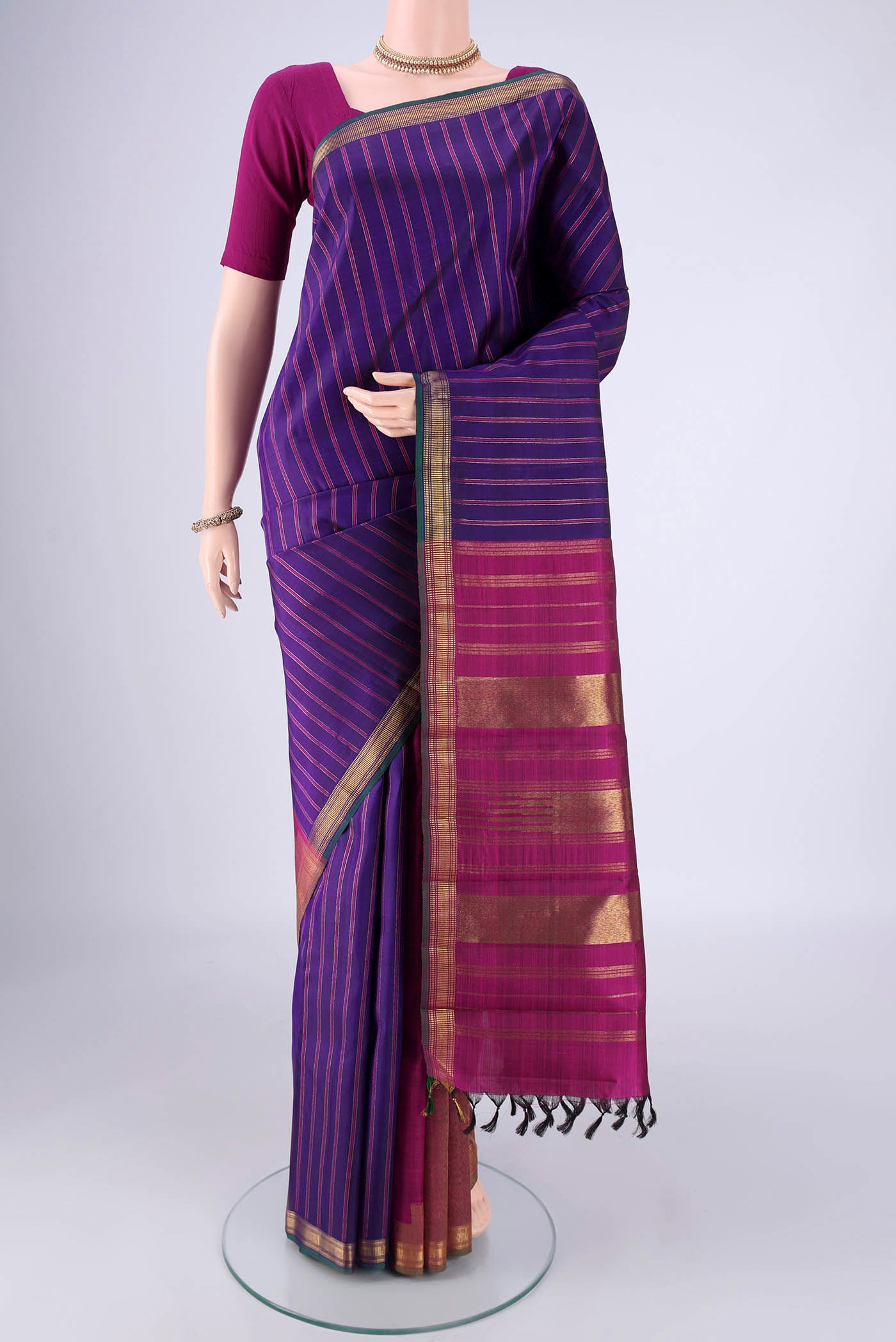 Pure Silk Pure Zari Dark Blue Kanchipuram Saree with Partli on the body and Zari Border.  displayed on a mannequin