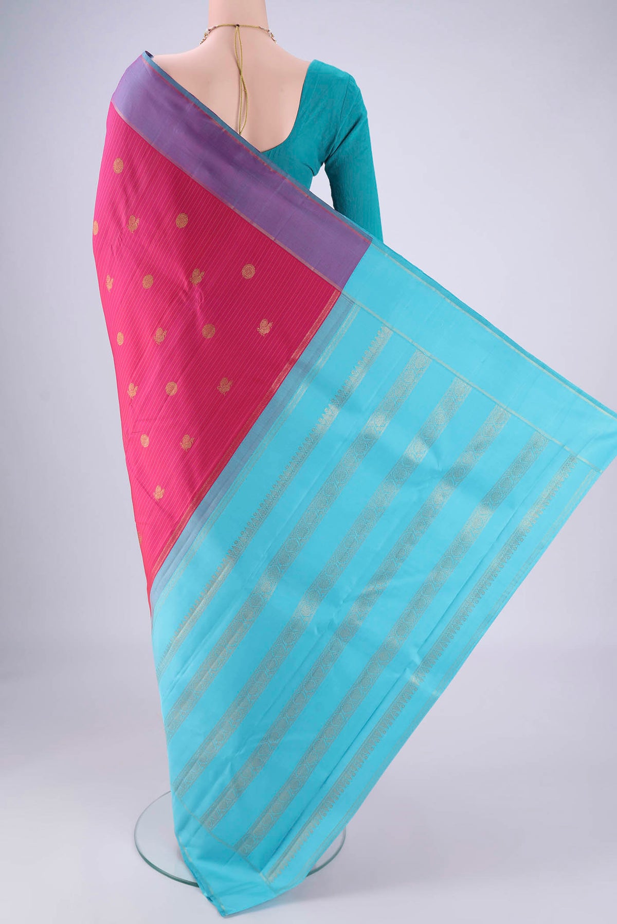 Flat view of Dark Pink Kanjivaram Silk Saree with Zari Butta on the body and Zari Border. 