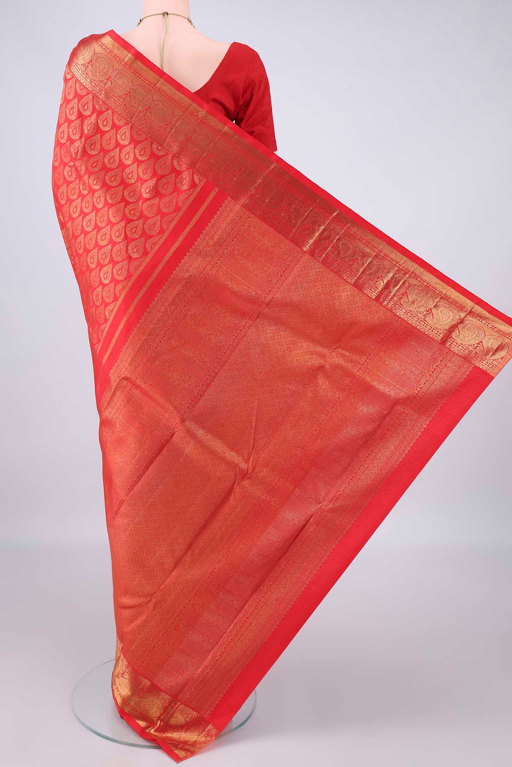 Flat view of Pure Silk Red Kanchipuram Saree with Zari Brocade on the body and Zari Border. 