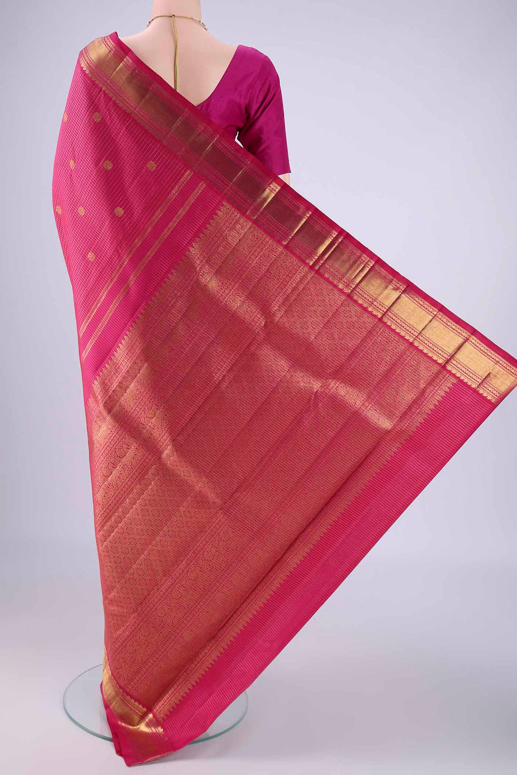 Flat view of Rani Pink Kanchipuram Silk Saree with Checked design on the body and Zari Border. 