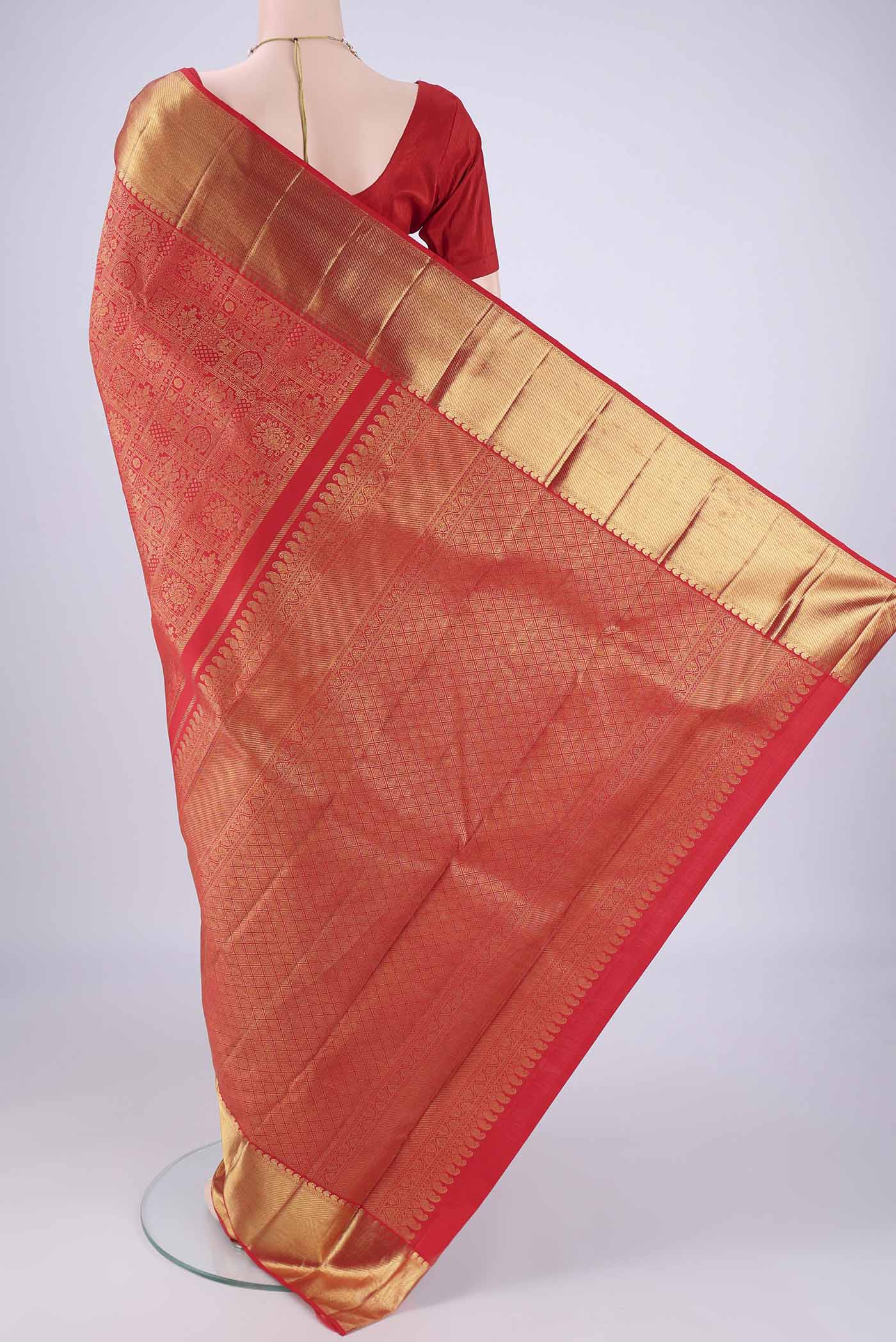 Flat view of Pure Silk Pure Zari Red Kanjivaram Saree with Zari Brocade on the body and Zari Border. 