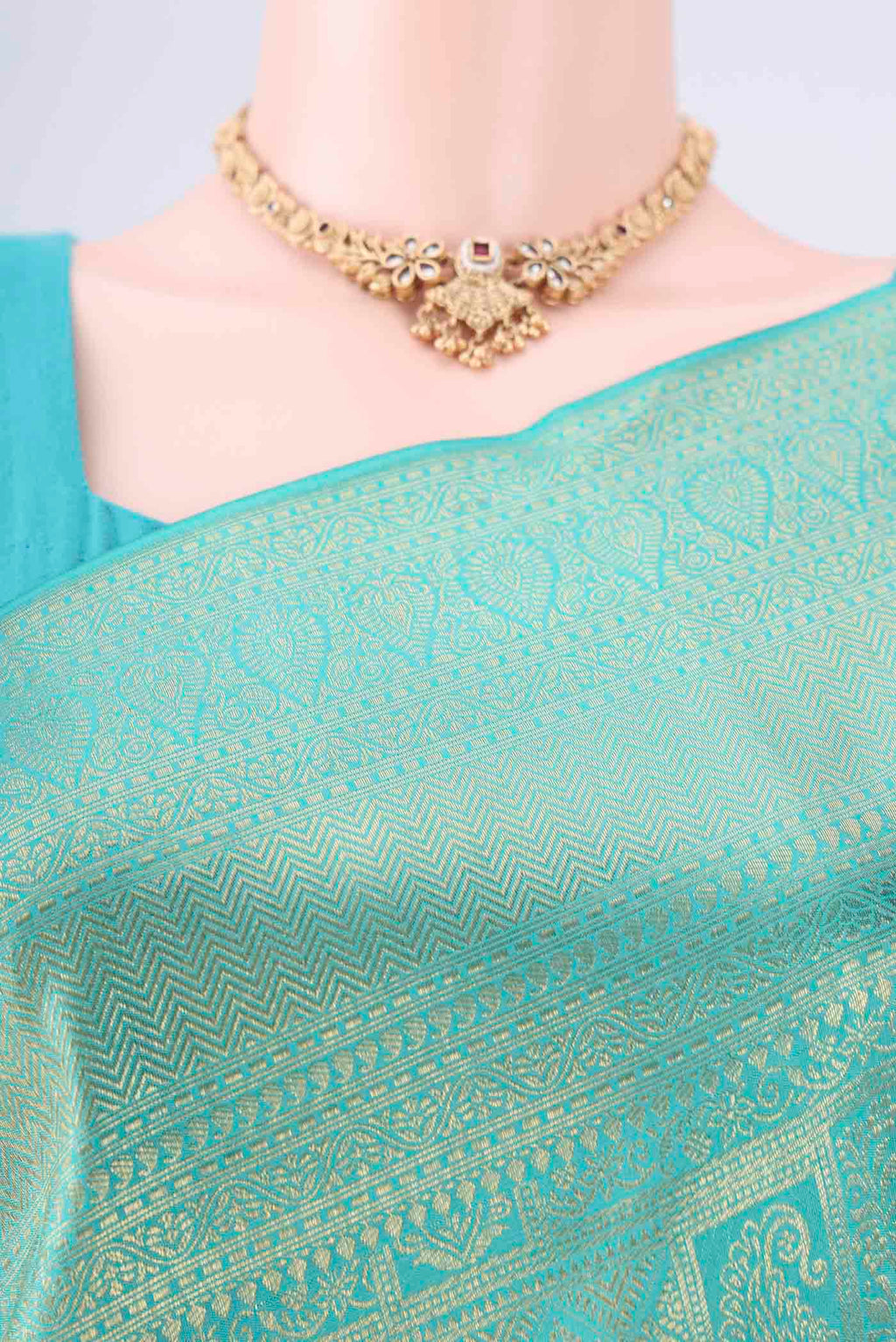 Border image of Turquoise Kanchipuram Silk Saree with Zari Brocade on the body and Zari Border. 