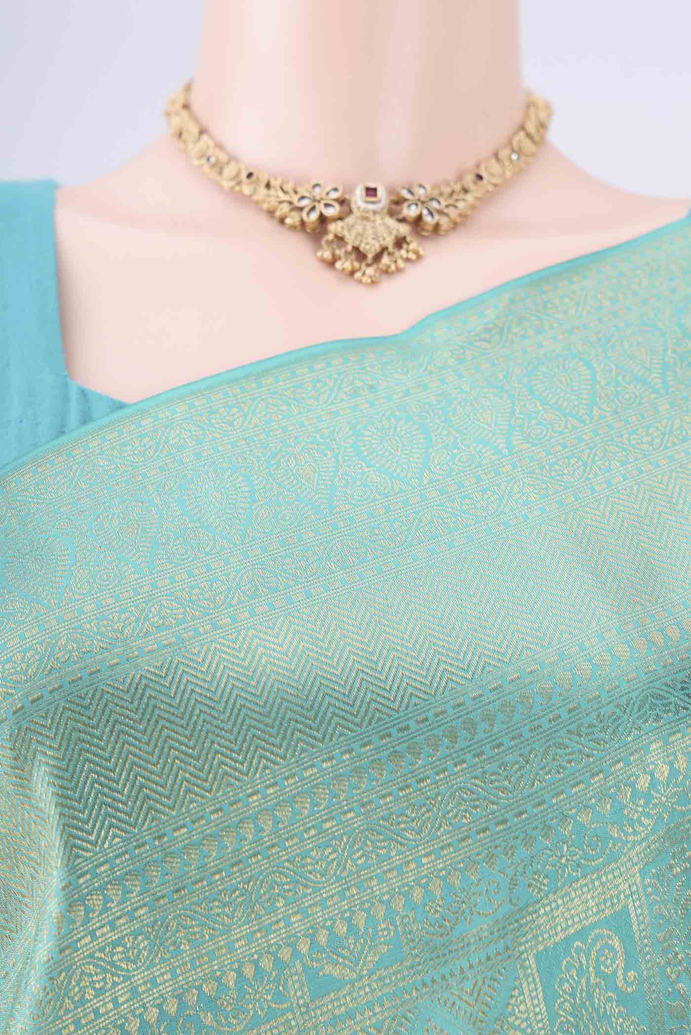 Border image of Turquoise Kanchipuram Silk Saree with Zari Brocade on the body and Zari Border. 