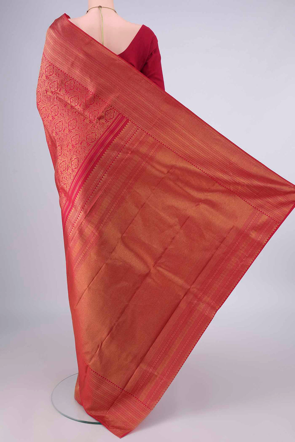 Flat view of Pure Silk Red Kanchipuram Saree with Zari Brocade on the body and Zari Border. 