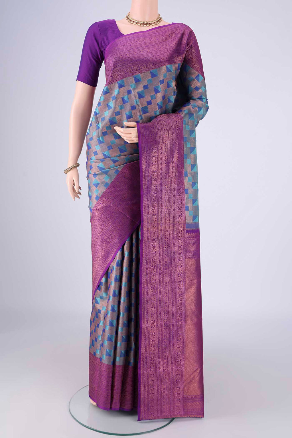 Turquoise Kanchipuram Silk Saree with Zari Brocade on the body and Zari Border.  displayed on a mannequin