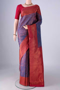 Purple Kanchipuram Silk Saree with Zari Brocade on the body and Zari Border.  displayed on a mannequin